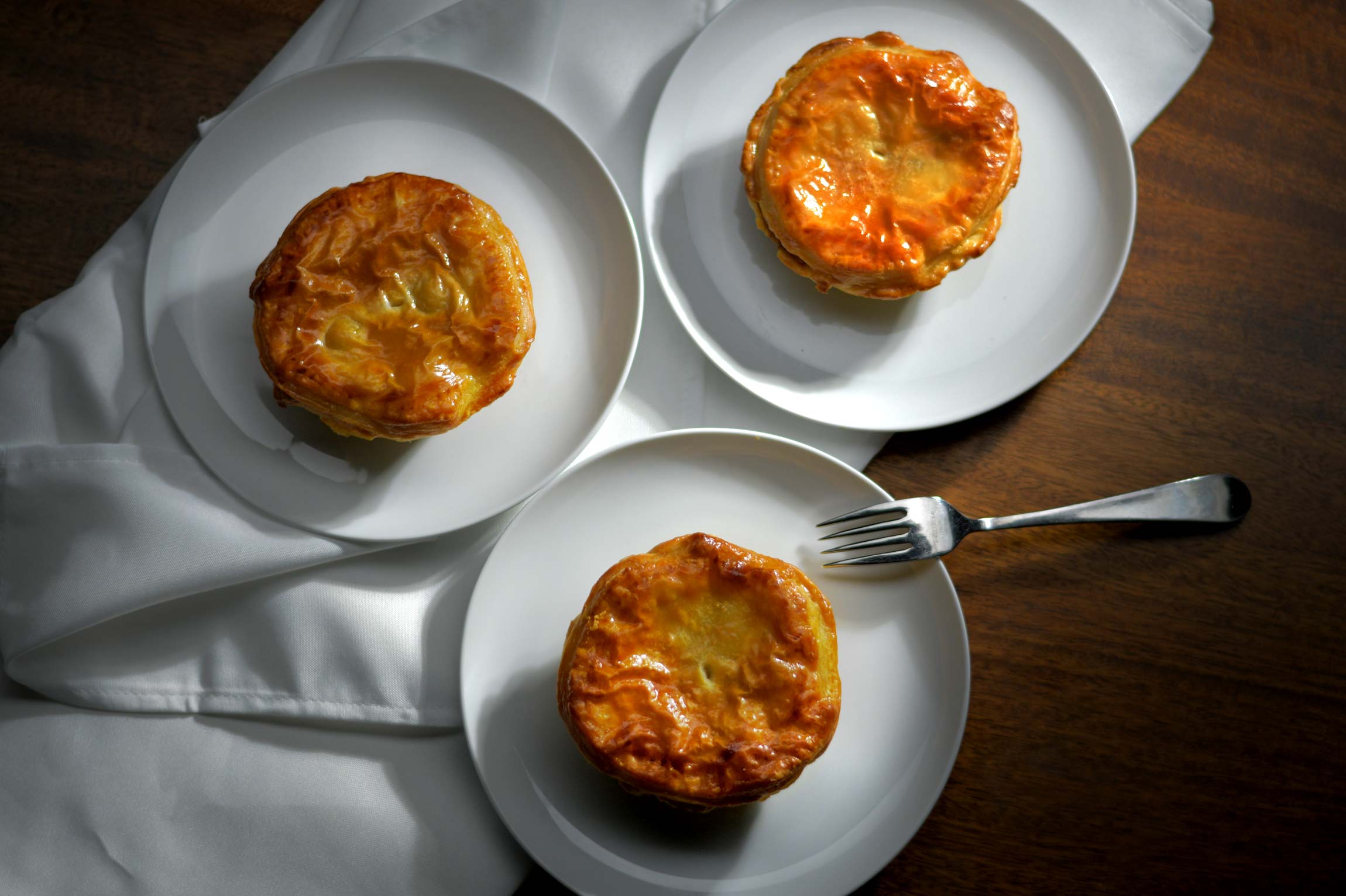 Three cooked puff pastry pot pies